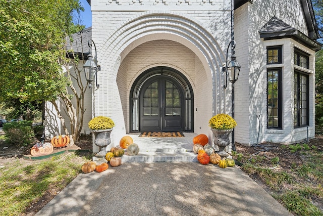 view of exterior entry featuring french doors