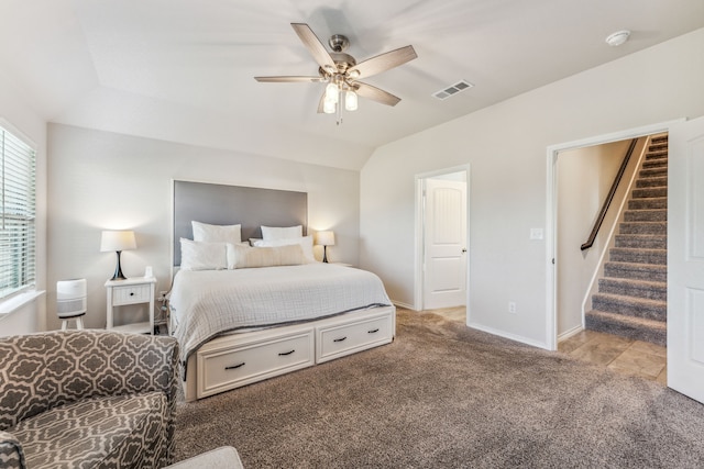 bedroom featuring light carpet, ceiling fan, and lofted ceiling