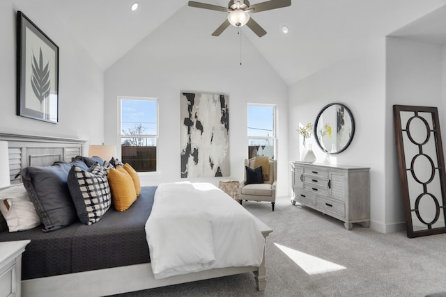 bedroom featuring ceiling fan, light carpet, and high vaulted ceiling