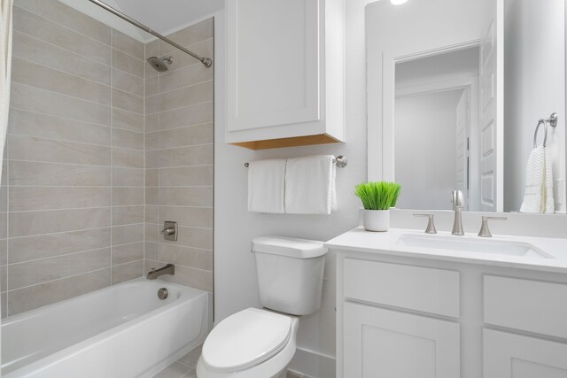 full bathroom with vanity, toilet, and tiled shower / bath