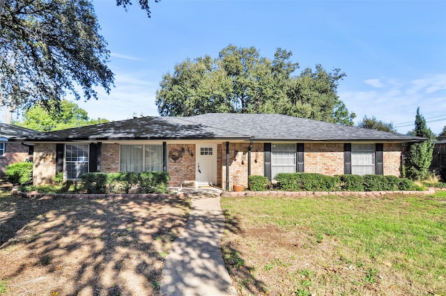 ranch-style home with a front lawn