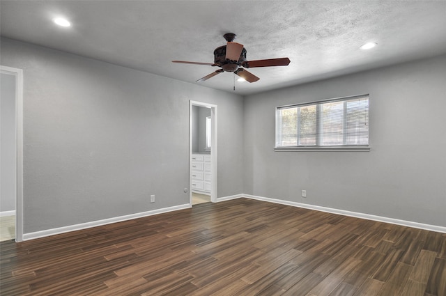 unfurnished room with dark hardwood / wood-style floors and ceiling fan