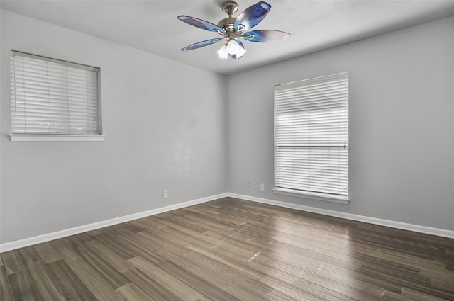 empty room featuring hardwood / wood-style flooring and ceiling fan