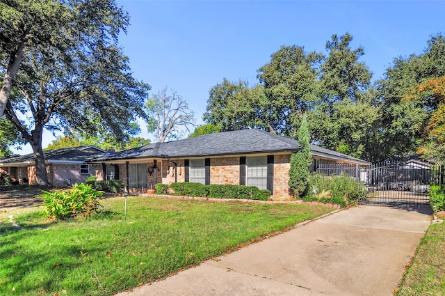 single story home featuring a front lawn