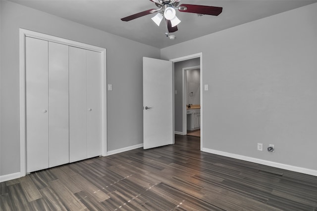 unfurnished bedroom with a closet, dark hardwood / wood-style floors, and ceiling fan