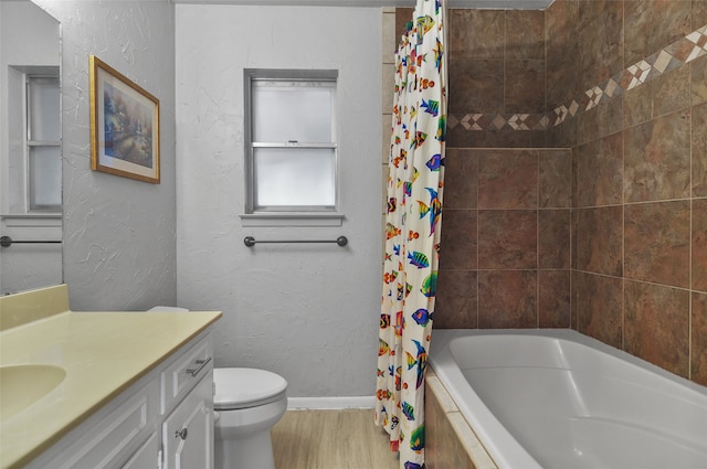 full bathroom featuring vanity, toilet, wood-type flooring, and shower / tub combo with curtain