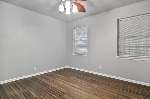 unfurnished room with ceiling fan and dark wood-type flooring