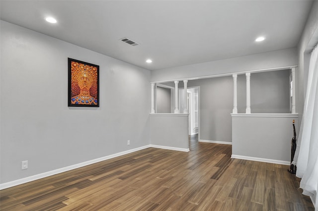 spare room featuring dark hardwood / wood-style floors