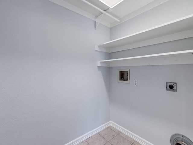 washroom featuring washer hookup, hookup for an electric dryer, and light tile patterned floors