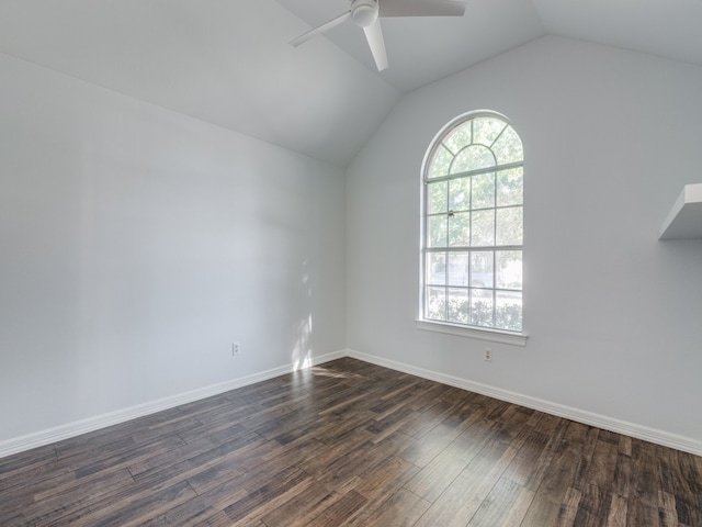 unfurnished room with dark hardwood / wood-style flooring, plenty of natural light, lofted ceiling, and ceiling fan