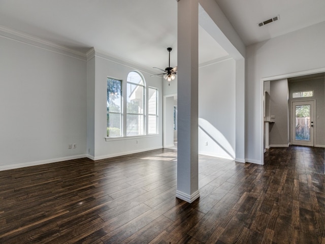 unfurnished living room with ceiling fan, crown molding, and dark hardwood / wood-style flooring