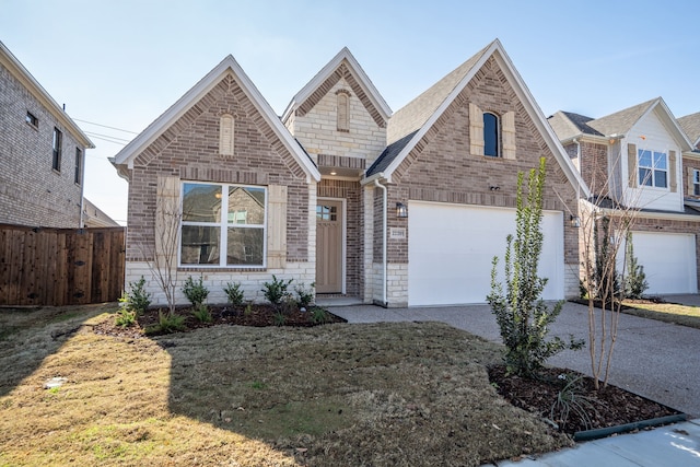 view of front of house with a front yard and a garage