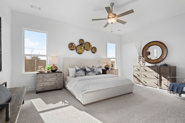 carpeted bedroom with ceiling fan