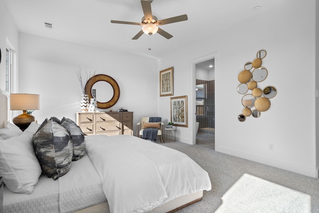 carpeted bedroom featuring ensuite bathroom and ceiling fan