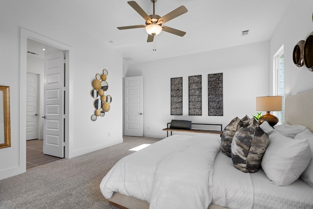 carpeted bedroom featuring ceiling fan