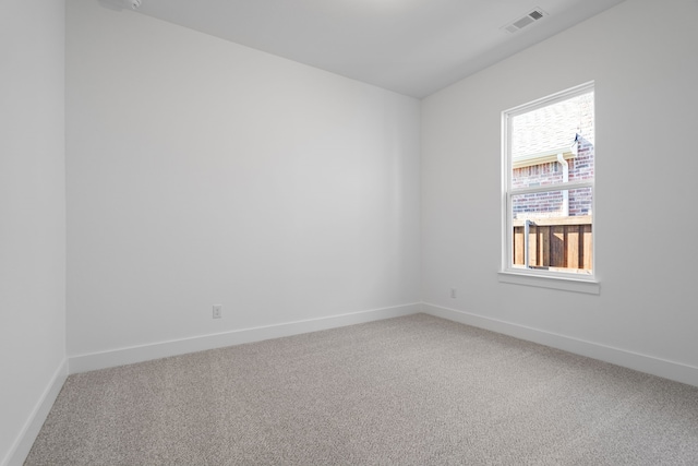 spare room featuring carpet floors