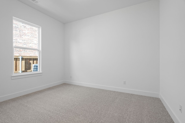 empty room with carpet flooring