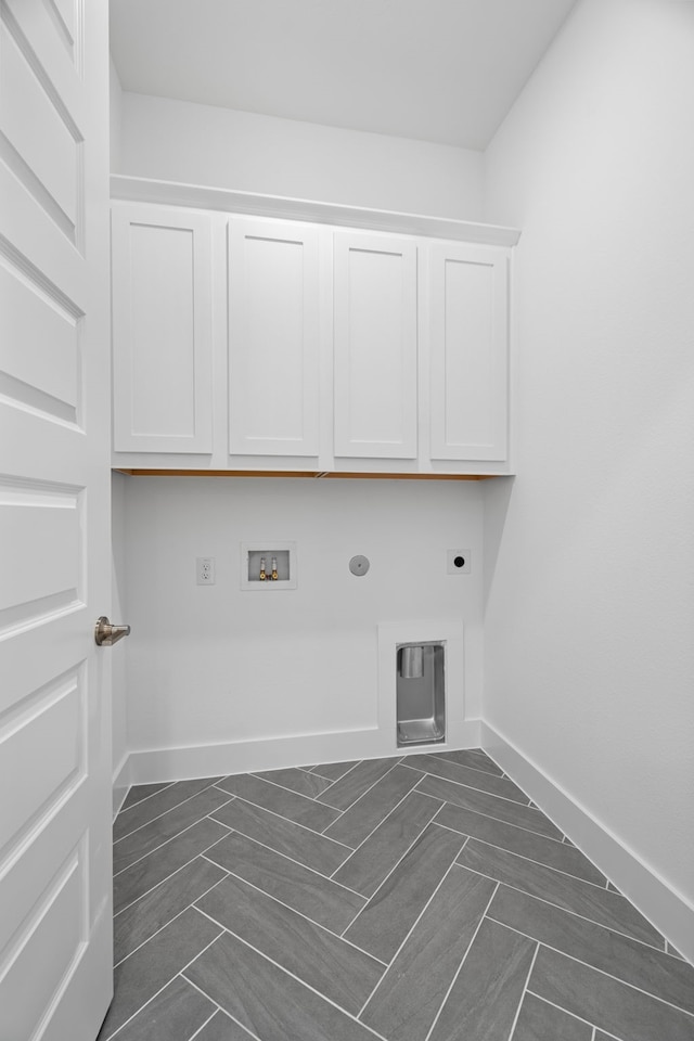 laundry area featuring cabinets, washer hookup, hookup for a gas dryer, and electric dryer hookup