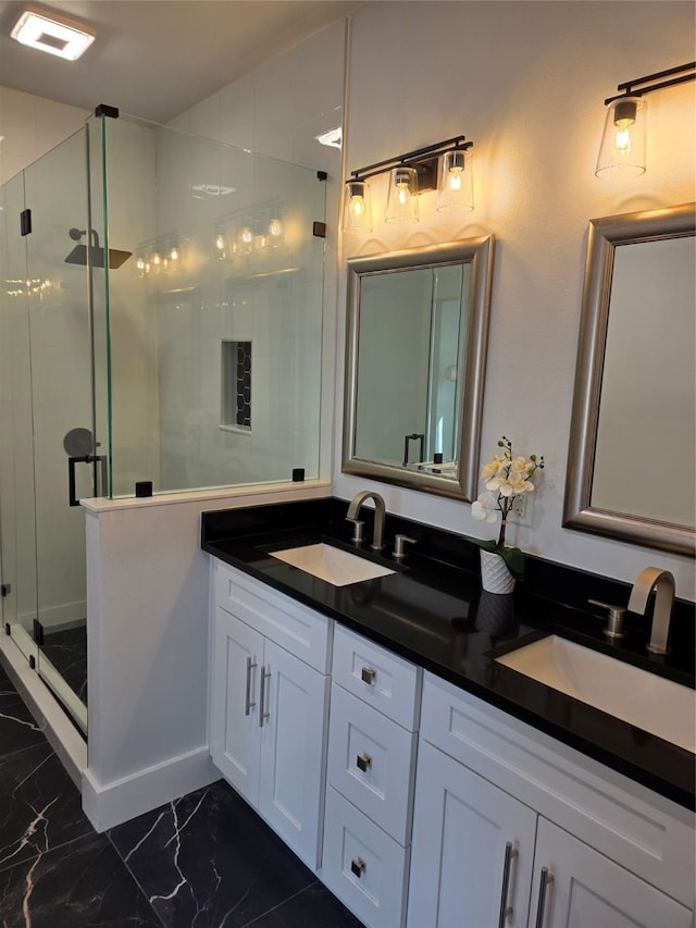 3612 Broken Bow Dr, Granbury, TX 76048 - full bath with double vanity, marble look tile flooring, and a shower stall