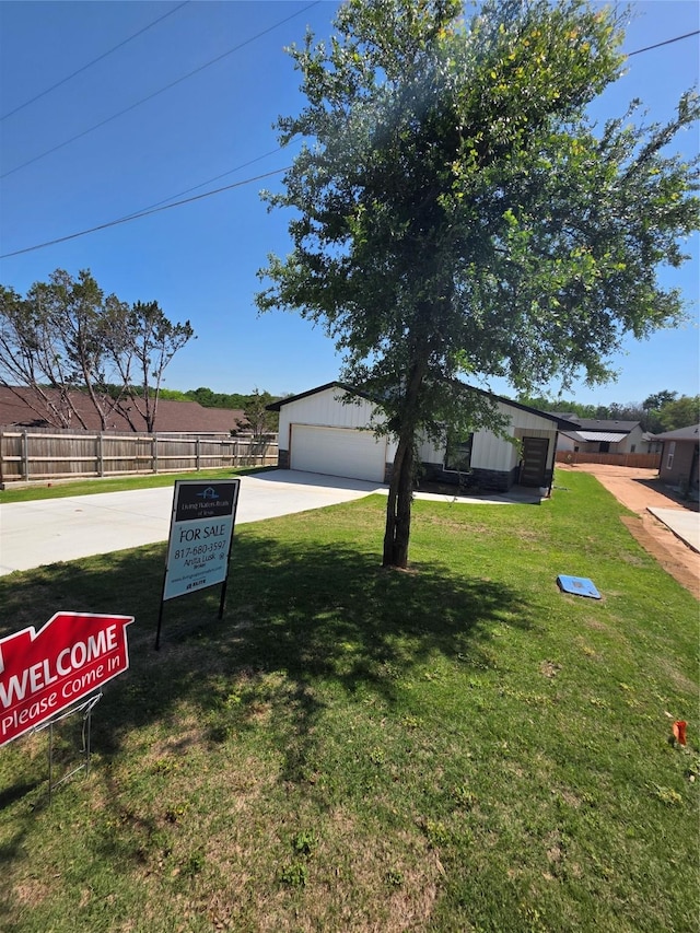3612 Broken Bow Dr, Granbury, TX 76048 - view of yard featuring a garage and driveway