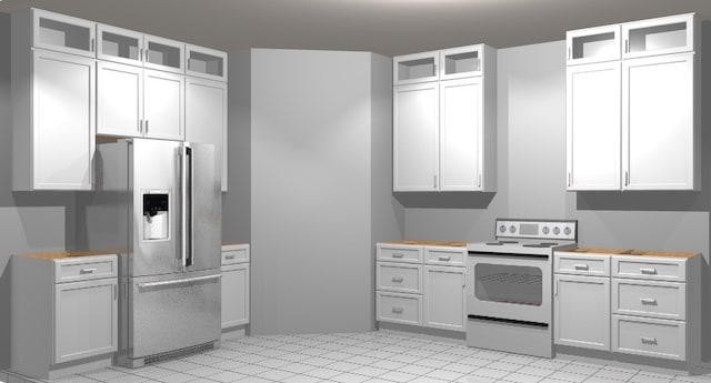 kitchen featuring stainless steel fridge, white cabinetry, and electric stove