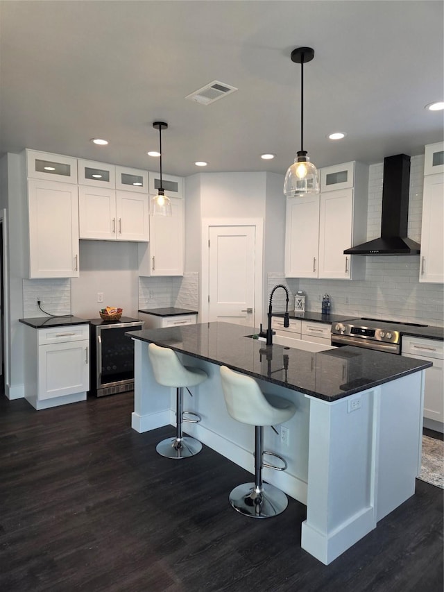 3612 Broken Bow Dr, Granbury, TX 76048 - kitchen featuring wall chimney range hood, wine cooler, a sink, electric range, and tasteful backsplash