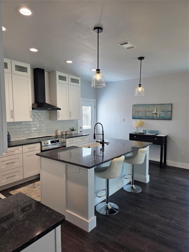 3612 Broken Bow Dr, Granbury, TX 76048 - kitchen featuring wall chimney range hood, a sink, baseboards, dark wood-style flooring, and white cabinetry