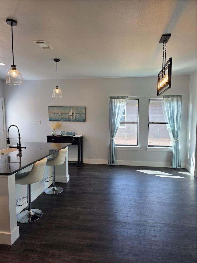 3612 Broken Bow Dr, Granbury, TX 76048 - dining space featuring dark wood-style floors and baseboards