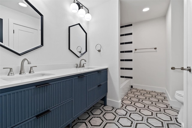 full bathroom featuring shower / washtub combination, vanity, and toilet