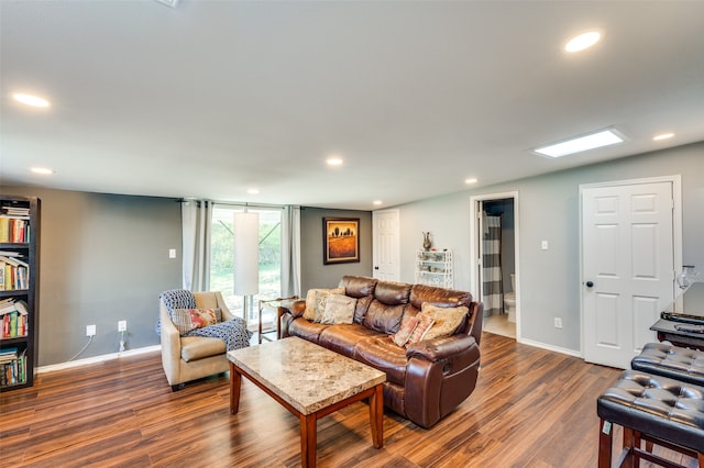 living room with dark hardwood / wood-style flooring