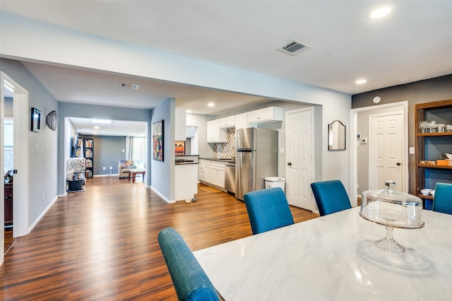 dining room with light hardwood / wood-style floors