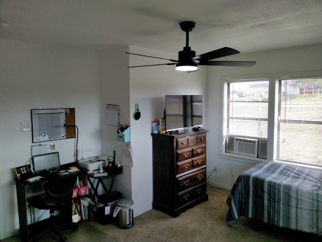 bedroom with ceiling fan, cooling unit, and light carpet