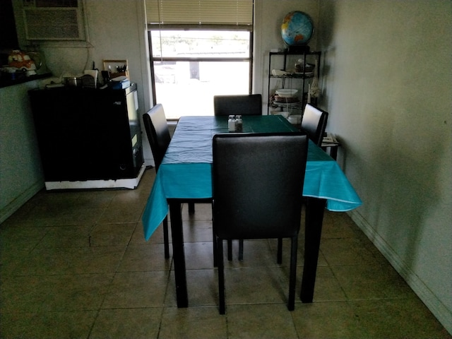 dining space featuring an AC wall unit