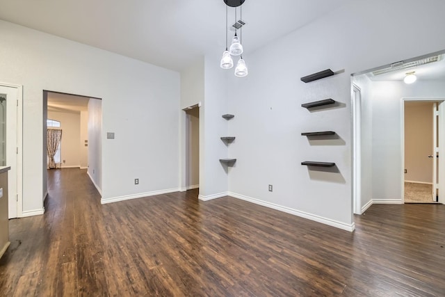 empty room with dark hardwood / wood-style flooring