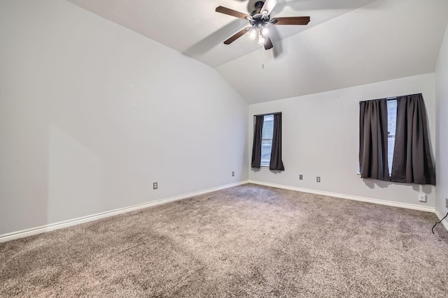 unfurnished room featuring lofted ceiling, carpet floors, and ceiling fan