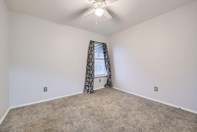 empty room with ceiling fan and carpet flooring