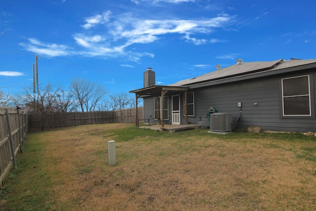 view of yard featuring cooling unit and a patio area