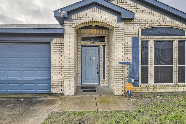 view of exterior entry featuring a garage