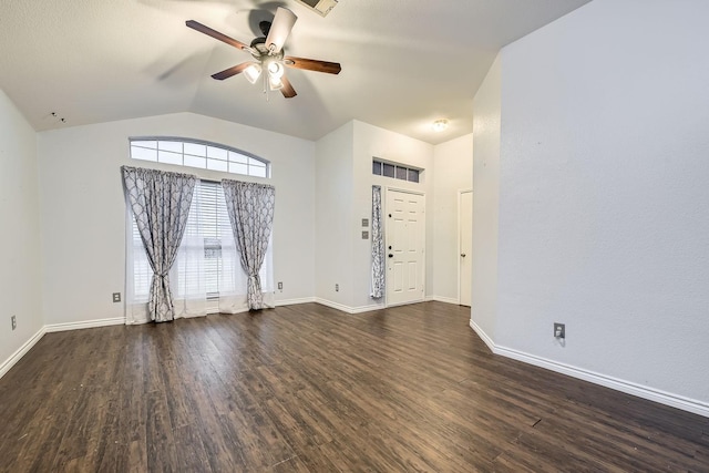 unfurnished room with vaulted ceiling, dark wood-type flooring, and ceiling fan