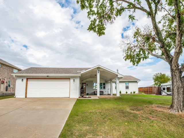 ranch-style home with a garage and a front yard