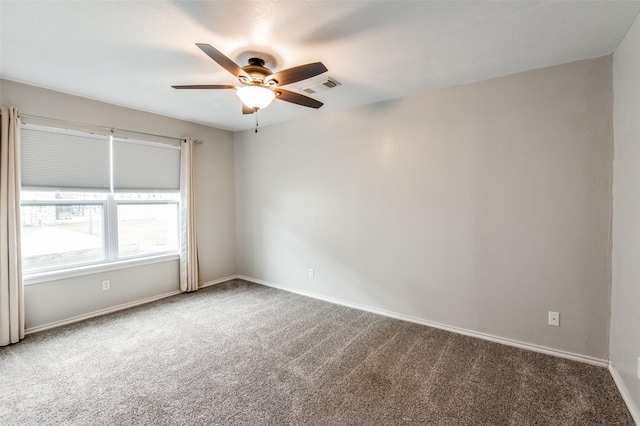 spare room with carpet and ceiling fan