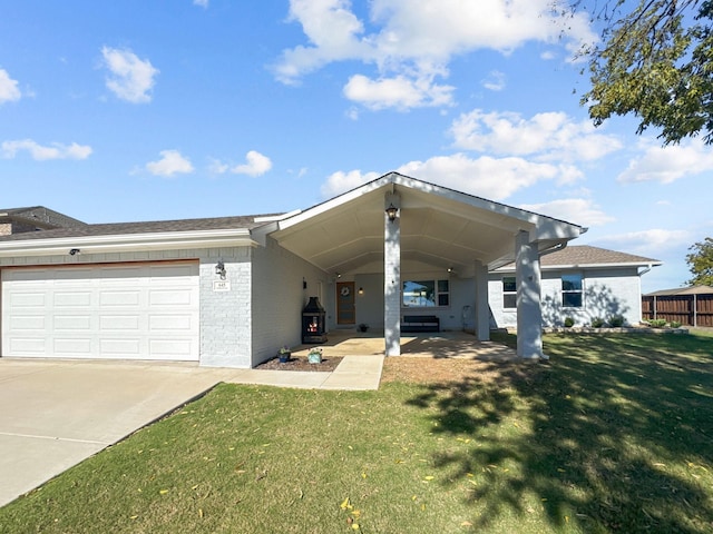 view of front of house with a front lawn and a garage