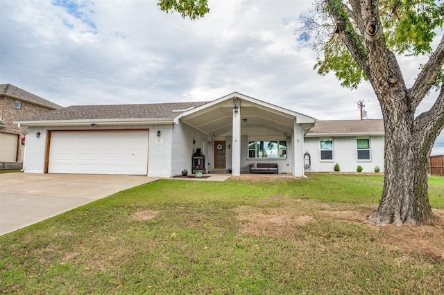 ranch-style home featuring a front yard and a garage