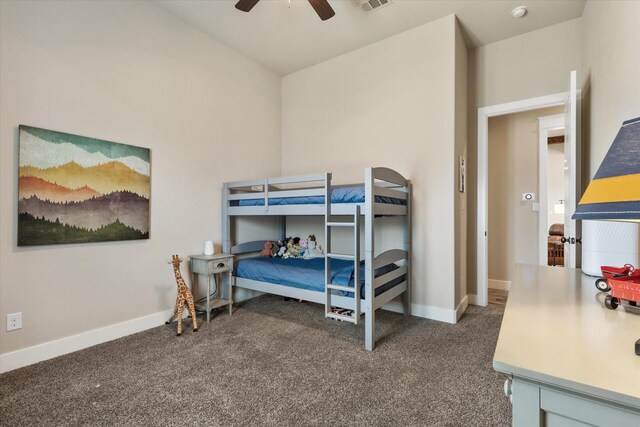 carpeted bedroom with ceiling fan and lofted ceiling