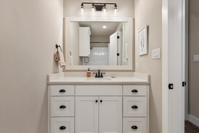 bathroom with vanity and walk in shower