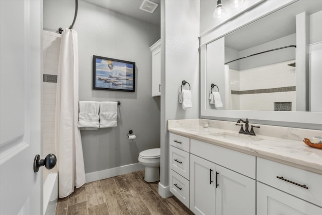 bathroom featuring a shower with curtain, wood-type flooring, toilet, and vanity