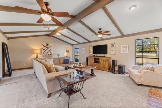 living room featuring light carpet, vaulted ceiling with beams, and ceiling fan