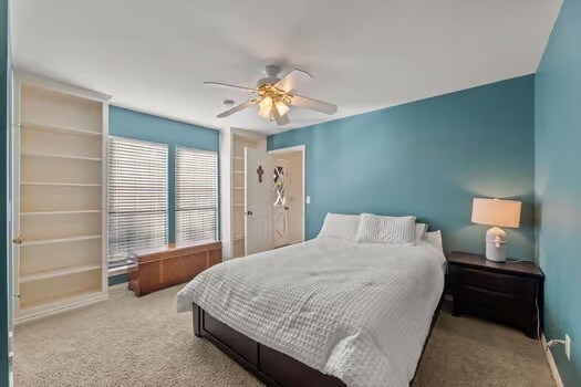 carpeted bedroom with ceiling fan