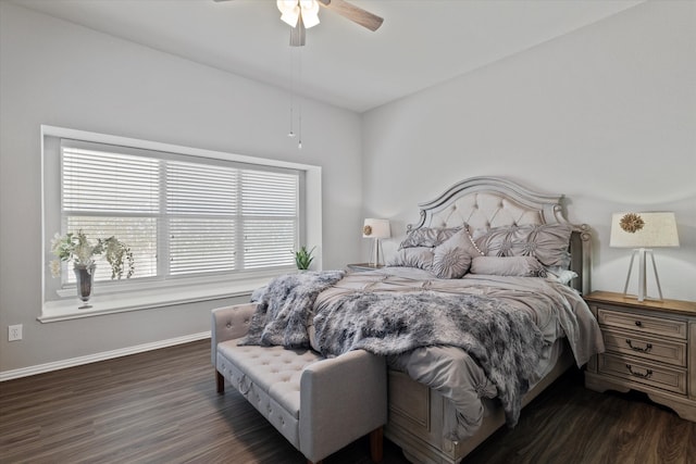 bedroom with dark hardwood / wood-style flooring and ceiling fan