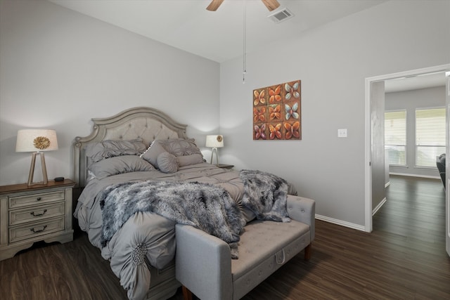 bedroom with ceiling fan, dark hardwood / wood-style floors, and lofted ceiling